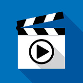 Vector illustration of a clapboard with a play button against a blue background in flat style.
