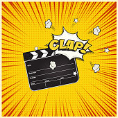 Clapperboard with Clap word speech bubble on vintage manga style background. Vector retro cinema illustration