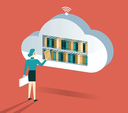 Cloud computing and Stack of Books - Businesswoman