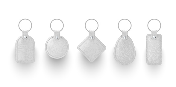 Collection realistic white leather keychains vector illustration. key chains with metallic ring