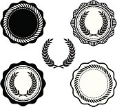 Collegiate style seals with laurel wreaths. 