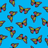 istock Colorful Monarch Butterflies Seamless Pattern 1309631654