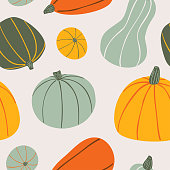 Food hand drawn vector seamless pattern. Stylized colorful pumpkins on light background. Cartoon Vegetables for wrapping paper, textile, background design for kitchen