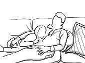 Dad and his daughter snuggling on the couch
