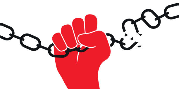Concept of freedom showing the arm of a prisoner who gets rid of his chains. Concept of the struggle for freedom of expression with the outstretched fist of a political prisoner who breaks his chain. hands tied up stock illustrations