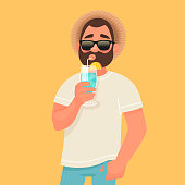 istock Concept of relaxation and summer vacation. A man in sunglasses is drinking a cocktail. Rest by the sea 1158100155