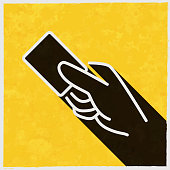 istock Contactless payment. Icon with long shadow on textured yellow background 1395370277
