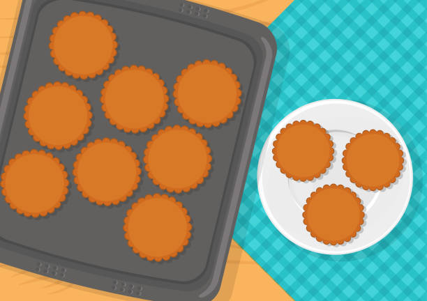 Cookies on baking sheet Vector illustration of sweet cookies on baking sheet and on plate baking sheet stock illustrations