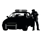 A vector silhouette illustration of a police officer standing beside his police cruiser with a detainee in tha back seat.