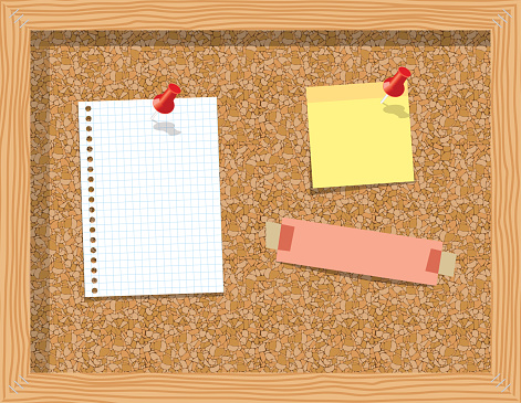Cork board with pinned paper notepad sheets