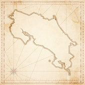 Map of Costa Rica in vintage style. Beautiful illustration of antique map on an old textured paper of sepia color. Old realistic parchment with a compass rose, lines indicating the different directions (North, South, East, West) and a frame used as scale of measurement. Vector Illustration (EPS10, well layered and grouped). Easy to edit, manipulate, resize or colorize. Please do not hesitate to contact me if you have any questions, or need to customise the illustration. http://www.istockphoto.com/portfolio/bgblue