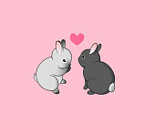 A couple of cartoon little rabbits with a heart on pink background. Bunny in love cute vector illustration for greeting card or print