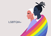 istock A couple of  young hugging characters covered with the LGBTQ+ rainbow flag, same-sex relationships, diversity and human rights 1273715170