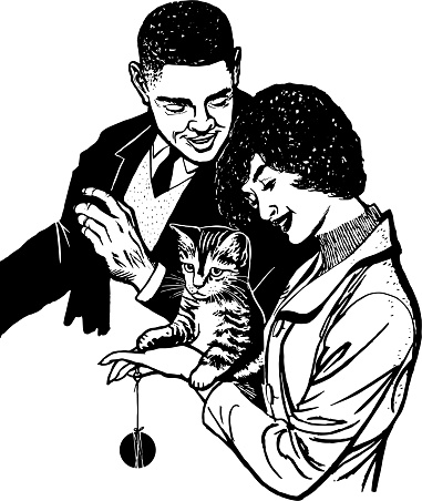 Couple Playing with a Cat