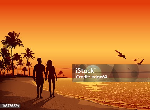 istock Couple walking on the Beach at Sunset 165736324