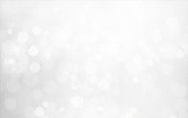 istock Creative sparkling shining very light grey and silver white coloured bokeh Christmas lights  horizontal vector backgrounds 1345824722