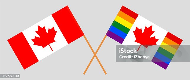 istock Crossed and waving flags of Canada and Canadian Pride Flag 1397776110