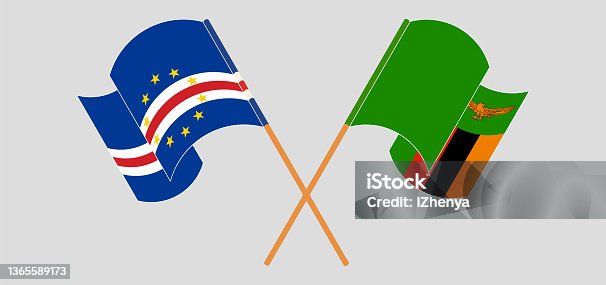 istock Crossed and waving flags of Cape Verde and Zambia 1365589173