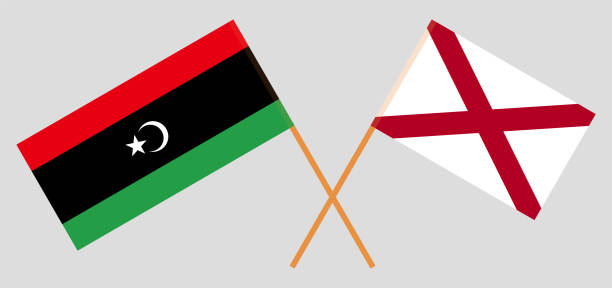 ilustraciones, imágenes clip art, dibujos animados e iconos de stock de banderas cruzadas de libia y el estado de alabama. colores oficiales. proporción correcta - alabama football