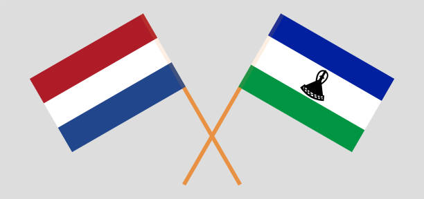 скрещенные флаги нидерландов и королевства лесото. официальные цвета. правильная пропорция - michigan football stock illustrations