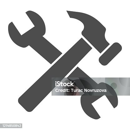 istock Crossed hammer and wrench solid icon. Repair tools and worker equipment symbol, glyph style pictogram on white background. Construction sign for mobile concept, web design. Vector graphics. 1214850842