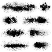 Set of grunge design elements. Crushed charcoal isolated black on white background. Black powder, dust, different shapes. Vector texture images.