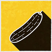 istock Cucumber. Icon with long shadow on textured yellow background 1397961093