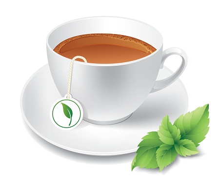 A cup of steeped tea with a green leaf on the side