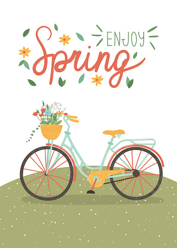 Cute colourful bike with flowers in the basket. Spring holidays concept. Easter and Mother's Day.