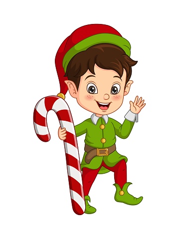 Cute little boy in christmas elf costume holding a candy cane