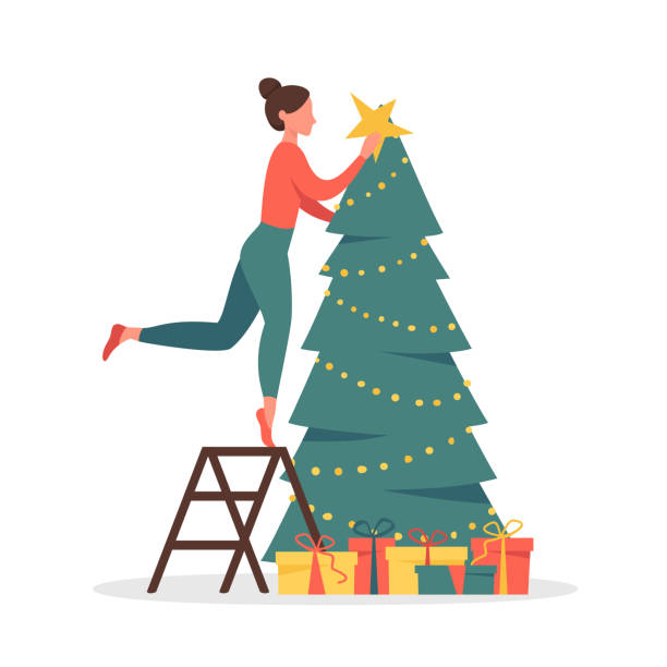 stockillustraties, clipart, cartoons en iconen met leuke vrouw versieren kerstboom met guirlandes en gouden ster. - vrouw kerstboom versieren