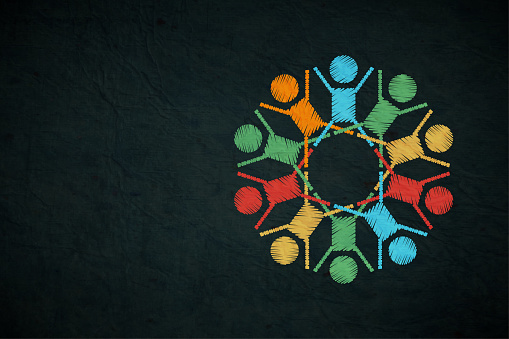 A vibrant horizontal vector backgrounds with many colourful abstract symbolic members of a family or a team in bright red, blue,  green and vibrant bright yellow colors having a round table discussion or meeting. There is no text and copy space. It symbolises a team or group of friends or human chain.