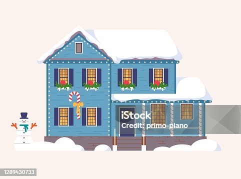 istock Decorated christmas house with snowman in yard 1289430733