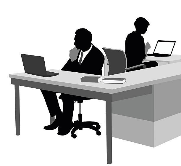 Dedicated Office Workers A vector silhouette illustration of a business man and a business woman sitting at their desks in an office using laptops. laptop silhouettes stock illustrations