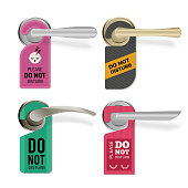 istock Door handle. Do not disturb hotel room signs vector tags set 1208756599