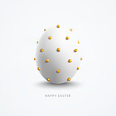 istock Easter Egg with hyper-realistic shading and small decorative golden balls supplied to the surface of the round object - single 3D object in vector standing vertically in the middle on a white background and Happy Easter text below 1306502214