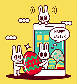 istock Easter greetings with smartphone, happy Easter bunny turning up on smartphone screen and sending Easter Eggs 1303412137