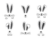 Easter vector bunny hand drawn, face of rabbits. Black and white ears and muzzle with whiskers, paws. Animal illustration
