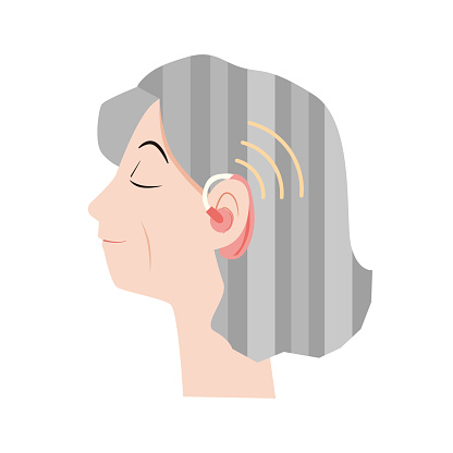 Elderly women using hearing aids