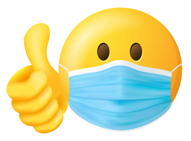 emoji smiley z maską lekarza i kciuki w górę symbol wektora izolowane - emoji stock illustrations