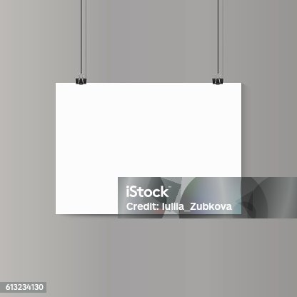 istock Empty horizontal white paper poster mockup on grey wall with 613234130