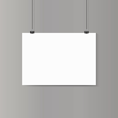 Empty horizontal white paper poster mockup on grey wall with