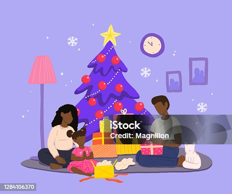 istock Family Celebrating Christmas in Cozy Home Environment with Presents 1284106370