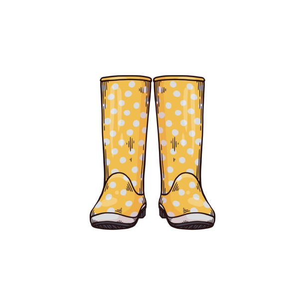 Fashion rubber boots for rainy weather of autumn or spring season. Fashion rubber boots for autumn or spring season. Yellow spotted waterproof kid or woman wellies in rainy weather. Vector sketch illustration isolated on a white background. spring fashion stock illustrations
