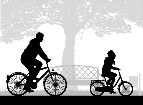 Father and daughter on a bike.
