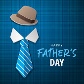 Celebrating the Father's Day with paper craft of shirt, necktie and cap on the blue checked pattern