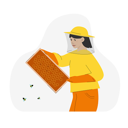 Female bee-keeper holding honey cells, caring bees. Apiary concept.