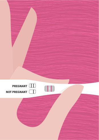 Female Hand Holding Pregnancy Test