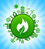 Fire Environment Green Button Background on Blue Sky. The main icon is placed on a round green shiny button in the center of the illustration. Environmental green living lifestyle icons go around the circumference of the button. Green building, man on a bicycle, trees, wind turbine, alternative energy and other environmental conservation symbols complete this illustration. The background has a blue glow effect.