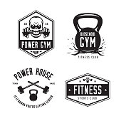 Fitness gym sports club labels emblems badges set. Monochrome design elements including skull, hammer, kettlebell. Vector vintage illustration.